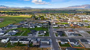 Aerial perspective of suburban area featuring a mountainous background
