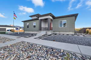 View of front of house with board and batten siding