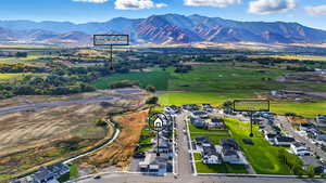 Aerial perspective of suburban area featuring a mountainous background