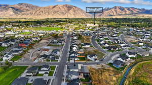 View of property location with nearby suburban area and a mountainous background