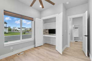 Unfurnished bedroom with light wood-type flooring, a closet, and ceiling fan