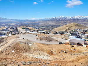 Aerial view of residential area featuring a mountain backdrop