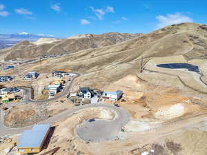 Aerial view of property and surrounding area featuring mountains