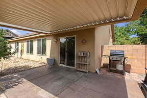 View of patio featuring area for grilling