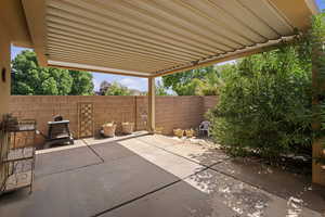 View of patio / terrace featuring a pergola with adjustable louvers