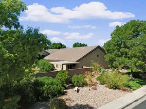 View of front facade with stucco siding and a tiled roof
