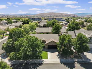 Aerial perspective of suburban area featuring a mountainous background