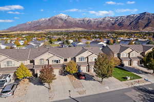 View of mountain backdrop featuring nearby suburban area