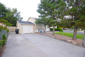View of front of home featuring driveway, stucco siding, and an attached garage