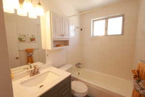 Bathroom with shower / tub combination and vanity