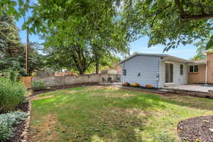 Fenced backyard featuring a patio area