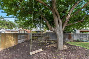 View of fenced backyard
