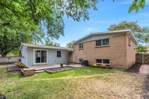 Back of property with a deck