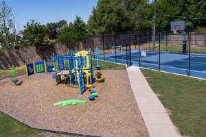 Communal playground featuring community basketball court