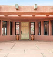 Entrance to property with a patio area