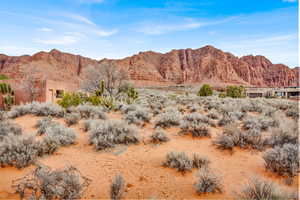 View of mountain backdrop featuring a desert landscape