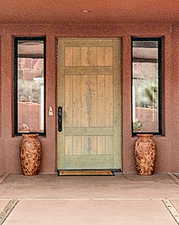 View of exterior entry featuring stucco siding