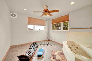 Empty room featuring light tile patterned flooring, recessed lighting, and a ceiling fan