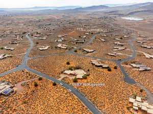 Overview of rural landscape with a mountain backdrop and a desert landscape