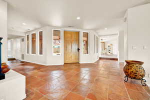 Entryway with recessed lighting and stone tile flooring