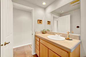 Bathroom featuring vanity and recessed lighting
