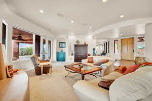 Carpeted living room featuring recessed lighting