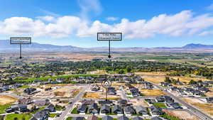 Aerial perspective of suburban area with a mountain backdrop
