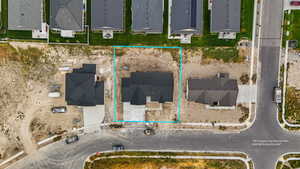 Aerial perspective of suburban area featuring property parcel outlined