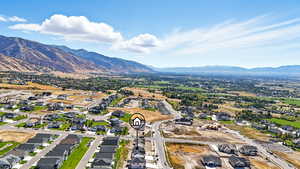 Aerial perspective of suburban area with a mountainous background