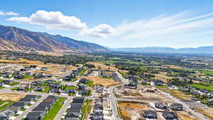 Aerial view of residential area featuring mountains