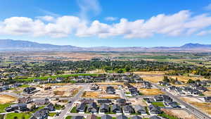 Aerial perspective of suburban area featuring a mountain backdrop