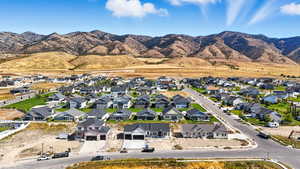 Aerial perspective of suburban area featuring a mountainous background