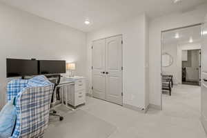 Office with light carpet, recessed lighting, and washer / clothes dryer