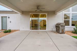 View of patio / terrace with ceiling fan and a grill