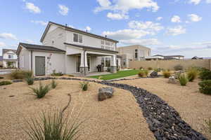 Back of property featuring a patio, stucco siding, and a fenced backyard
