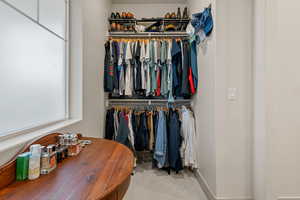 Walk in closet featuring carpet floors