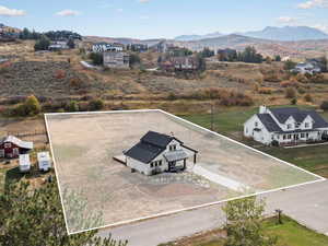 View from above of property featuring property boundaries highlighted and mountains