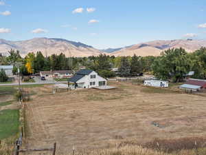 View of mountain backdrop with rural landscape