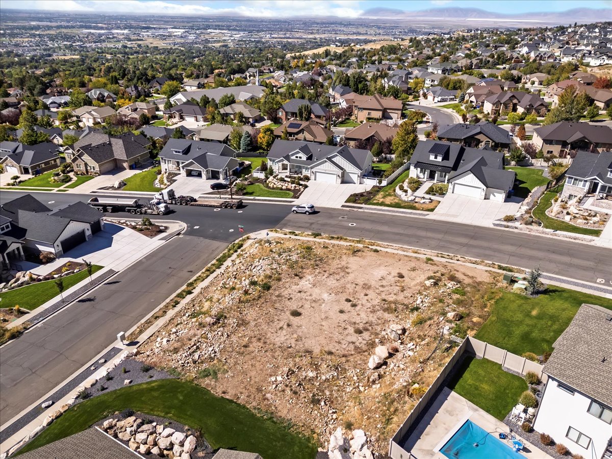 Aerial view of property's location with nearby suburban area