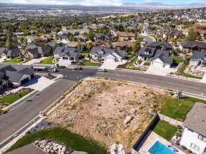 Aerial view of property's location with nearby suburban area