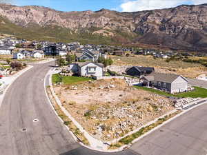 Aerial perspective of suburban area with a mountainous background