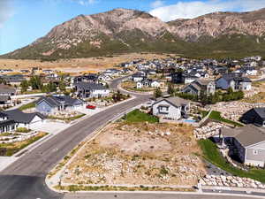 Aerial perspective of suburban area featuring a mountain backdrop