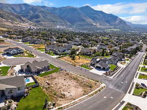 Aerial perspective of suburban area with a mountainous background