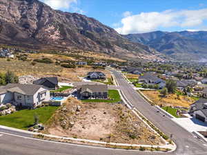 Aerial perspective of suburban area with a mountain backdrop