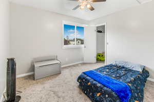Bedroom with carpet and ceiling fan