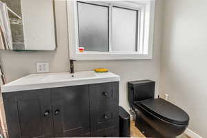 Bathroom featuring vanity and toilet