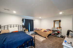 Carpeted bedroom featuring recessed lighting