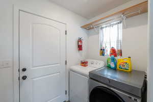 Laundry room featuring washing machine and dryer