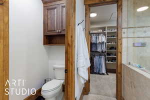Bathroom with toilet and a spacious closet