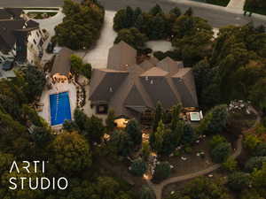 Aerial view of property's location with a pool area